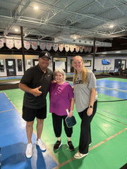 Jeff Brandes with a beginner pickleball player on the AAC court